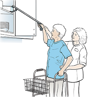 Healthcare provider showing woman how to use long-handled reacher.